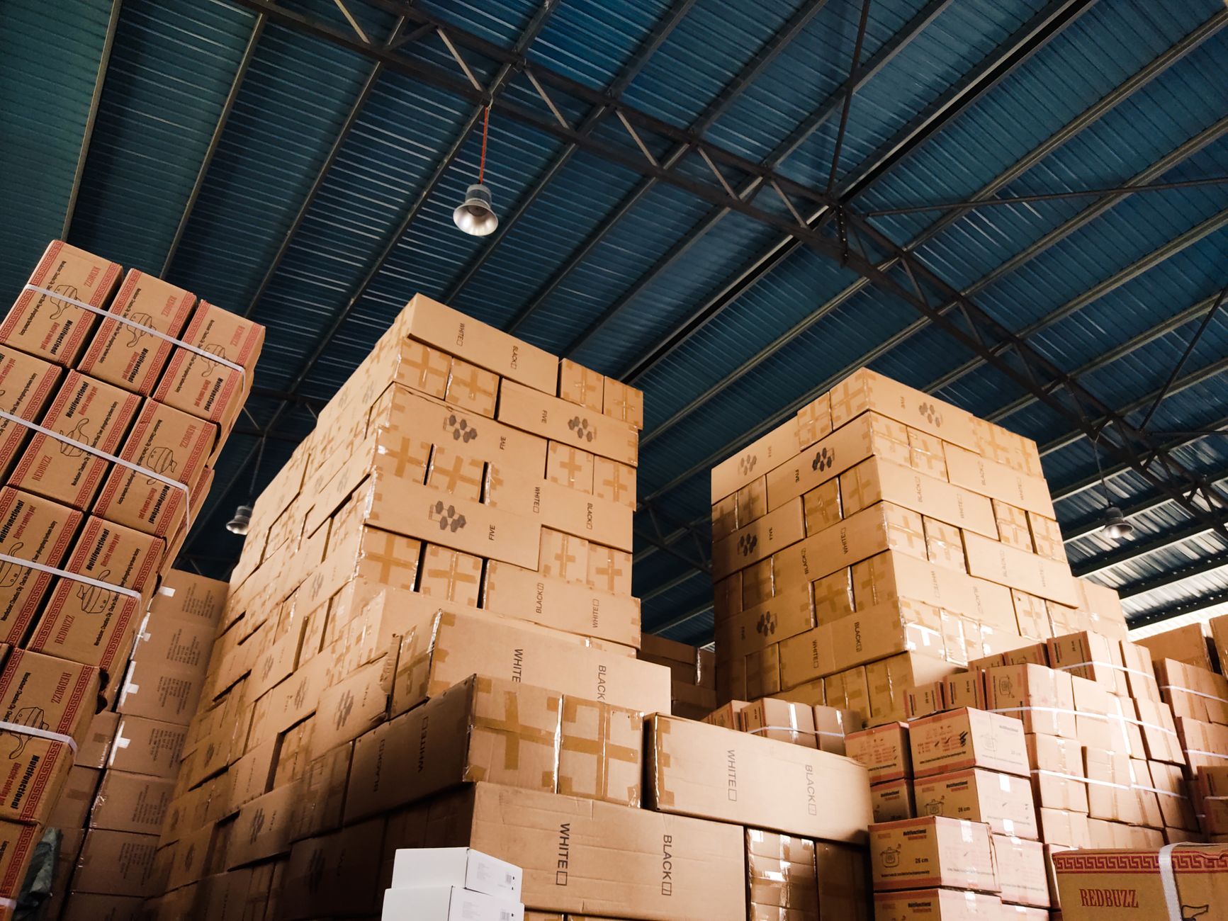 Stacked cardboard boxes in a distribution warehouse