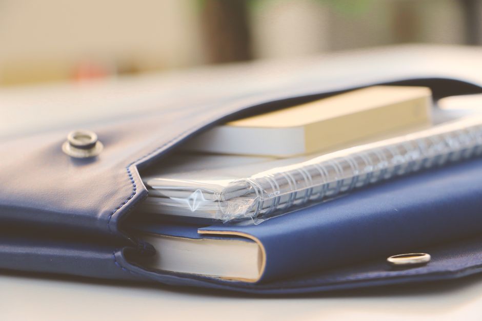 Notebook and laptop on a desk for planning